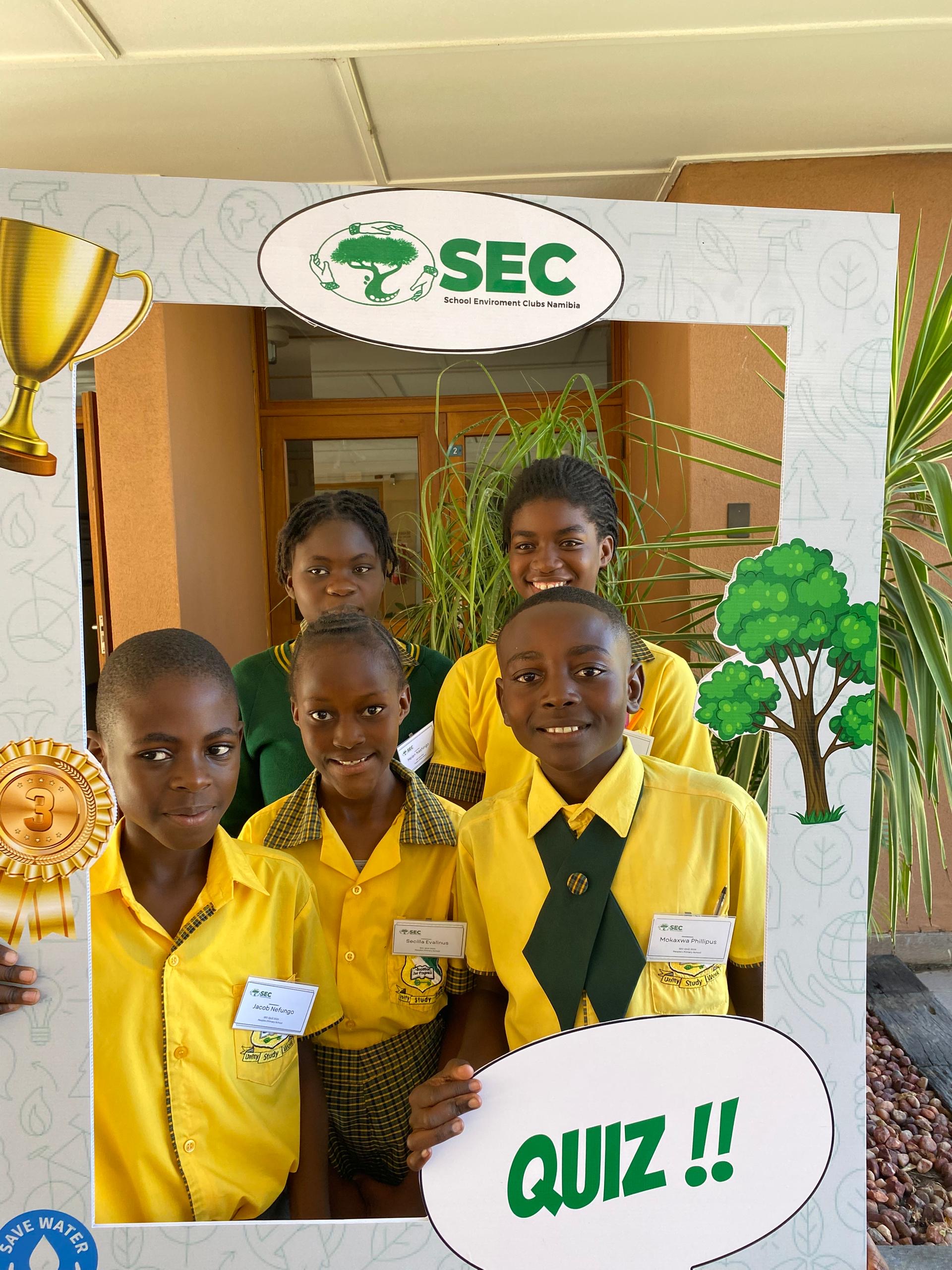 Primary school learners holding medals at the SEC Primary Schools Quiz
